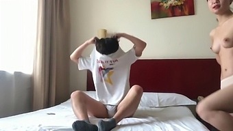 A Pair Of Chinese Lovers Get Intimate In A Hotel Suite